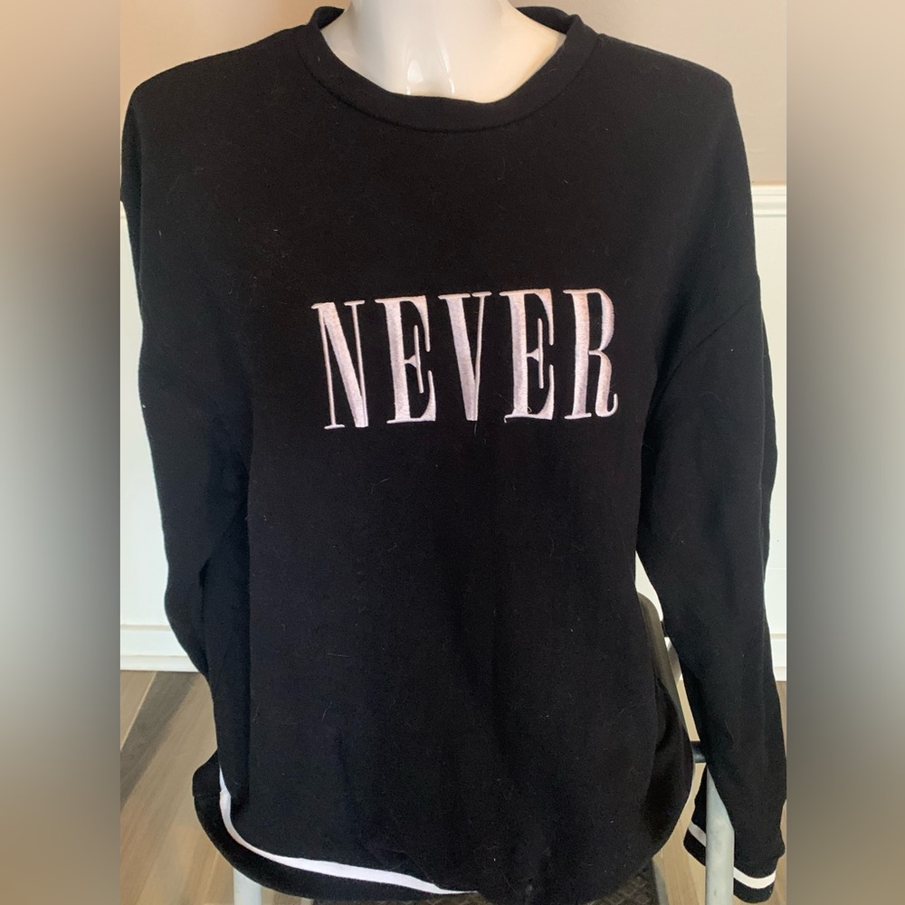 Divided Never black sweater.  Crewnevk Like new. Large. Smoke free